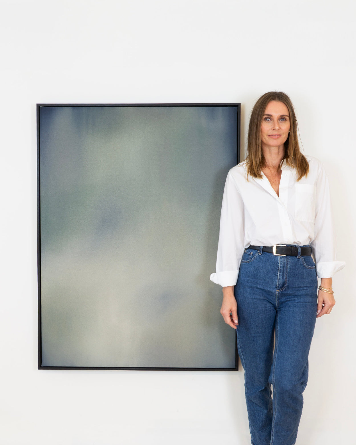 Michelle Wilkin with her artwork 'Out of the Blue' from her 'Imprints' series