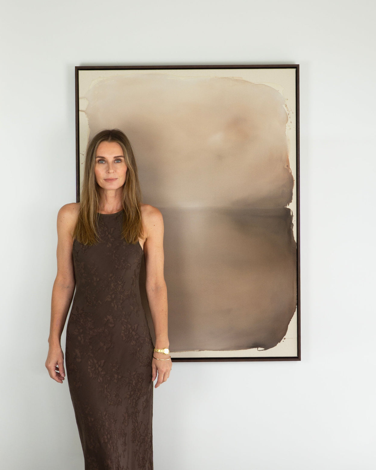 Artist Michelle Wilkin with an artwork from her new series INTERLUDES